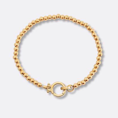 Pulsera Esferas y Círculo Acero Baño Oro