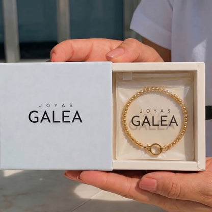 Pulsera Esferas y Círculo Acero Baño Oro
